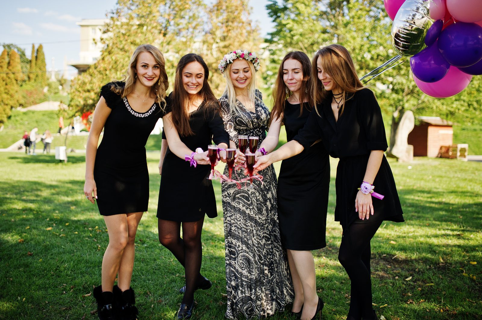 A group of friends celebrating outdoors at an event